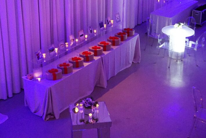 table lined with round gift boxes