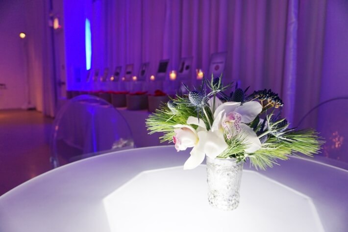 white orchids in silver vase